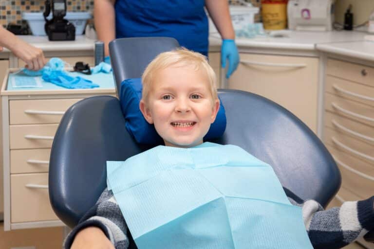 little-boy-at-dentist-s-office-child-smiling-whil-2022-11-10-09-30-29-utc