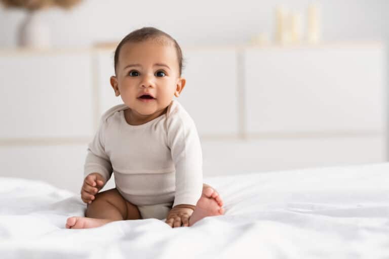 Cute,Little,African,American,Infant,Sitting,On,Bed