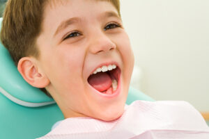 Smiling young boy in dental care