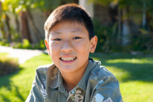 Smiling young boy with braces