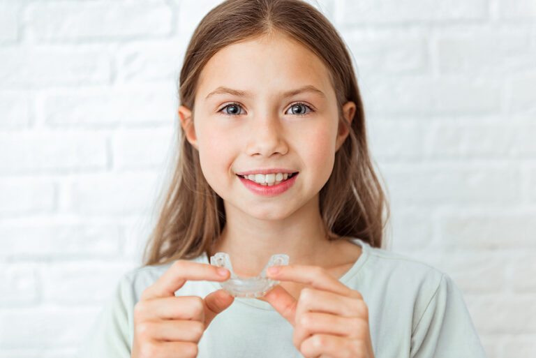 Smiling Child Girl With Perfect And Healthy Teeth Using Removabl